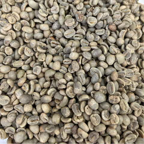 A close-up image of green, unroasted coffee beans.