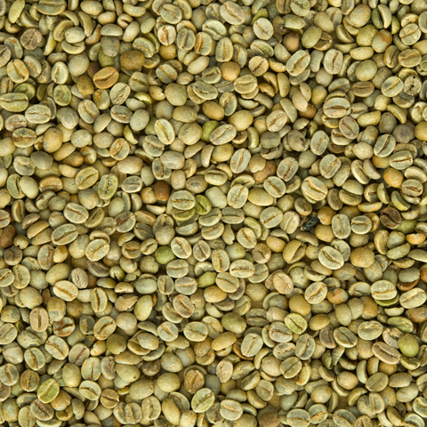 A close-up image of green, unroasted coffee beans.